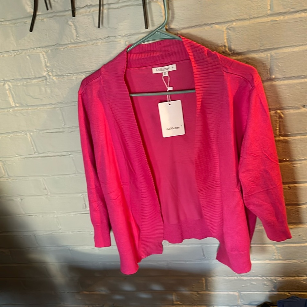 Dark pink sweater.